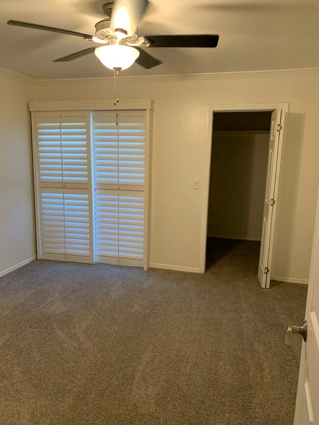 Bedroom with walk in closet and new double pane sliding glass doors to private balcony/deck - 436 N Bellflower Blvd Unit 218