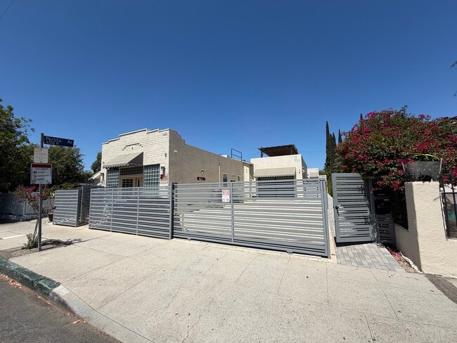 view from street of property. House is in middle of property - 4131 Chevy Chase Dr Unit 4131