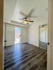 smaller second bedroom looking out on patio. 10 feet 5 inches in length. 8 foot 6 inches wide - 1757 17th St Apartments Unit #3