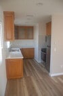Kitchen with new stainless steel appliances, quartz counter top, lots of cabinet storage - 813 7th St Unit 813