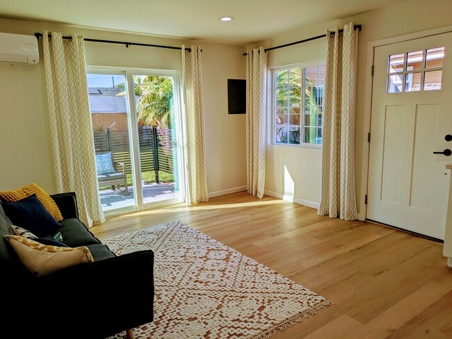 Living room with sliding door to patio - 4250 E Overlook Dr Unit 1-bedroom cottage