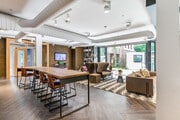 Watch the game in the community lounge or the courtyard - Malden Station by Windsor Apartments