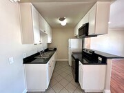 Photo - Bright Upstairs 2BR/1.5BA with Parking & G... Condo Unit 17