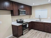 Photo - Charming 1-Bed with Private Patio & In-Unit Laundry — Central A/C, Parking, and All Major Applian... Unit B