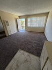 Living room from kitchen - 2133 Elden Ave Unit Elden East Apartments