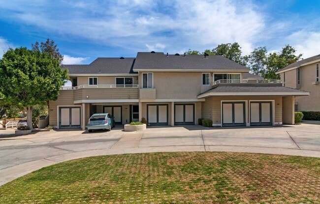 Middle two garages, entryway on the left - 5193 68th St Townhome