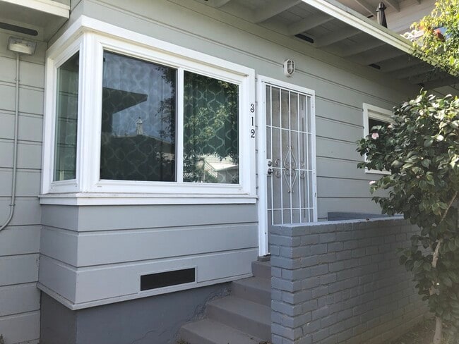 Front entrance and large window. - 310 -316 Rosecrans St