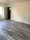 Living room and front door - 11702 Crenshaw Blvd Unit D