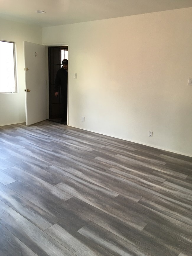 Living room and front door - 11702 Crenshaw Blvd Unit D
