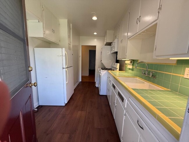 Kitchen from the back door. - 1755 Silver Lake Blvd Unit 1755