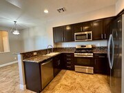 Photo - 3 Bed 2.5 Bath plus extra room Townhouse Style Condo / Attached 2 Car Garage