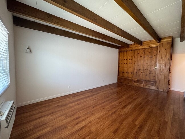 Photo - Large and Bright Studio with wood ceiling beams and floors... Unit Cordova St 216 C