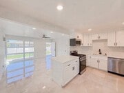 Photo - Renovated Triplex with Private Yard, AC, and Parking