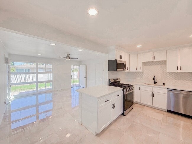 Photo - Renovated Triplex with Private Yard, AC, and Parking