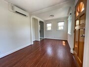 Living room facing north with access to kitchen - 3534 Helms Ave