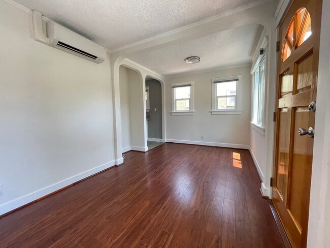 Living room facing north with access to kitchen - 3534 Helms Ave