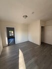 Living room to primary bedroom - 1929 Daly St Apartments Unit 1-2 One Half