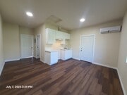 Living room / kitchen - 1221 W 152nd St Apartments