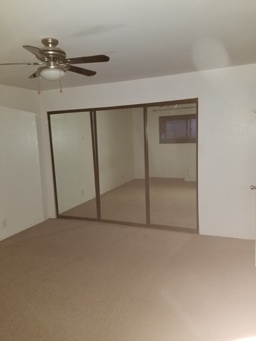 Bedrm w/ceiling fan & mirrored closet - 200 Elm Ave Unit #7