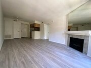 1BR, 2BA - 750 - LR & Dining area - A & J Investments