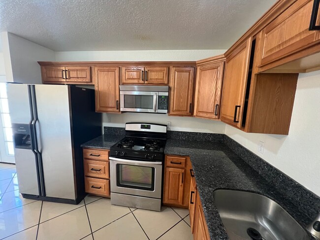 Photo - Move-In Ready Beauty with Granite Kitchen, Stainless Steel Appliances & Expansive Backyard