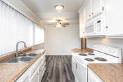 2BR, 2BA - 950SF - Kitchen/Dining Room - Robin Meadows of Garden Grove Apartments