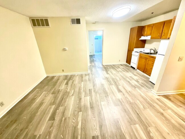 Living Room/Kitchen/ Hallway Not Remodeled - 55+ Senior Living- Georgia Regency Apartments