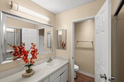 2BR, 2BA - 975SF - Primary bathroom - The Village at Granada Hills