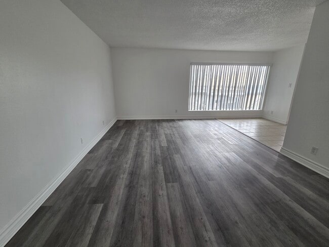 Living room with Luxury Vinyl Plank - 3455 Elm Ave Unit #307