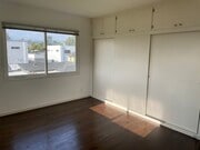 Large bedroom with wall of closets - 609 N Mariposa Ave Apartments Unit 609