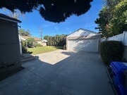 View from driveway into backyard - 11235 Lynrose St