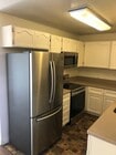 Photo - Beautiful Townhome with large fenced back patio, second story balcony, and two covered parking spots