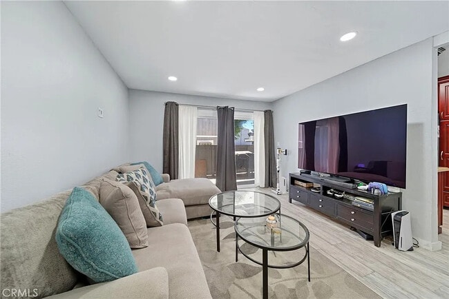 Building Photo - Bright 2-Bed Condo with Central Air, Pool Access & Carport in Anaheim Unit 1013