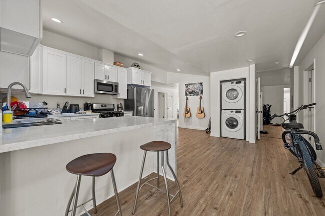 Photo - Two full kitchens + two washers & dryers!