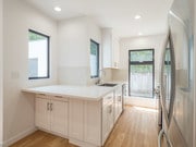 kitchen/view to back yard - 10618 Ayres Ave Unit Duplx