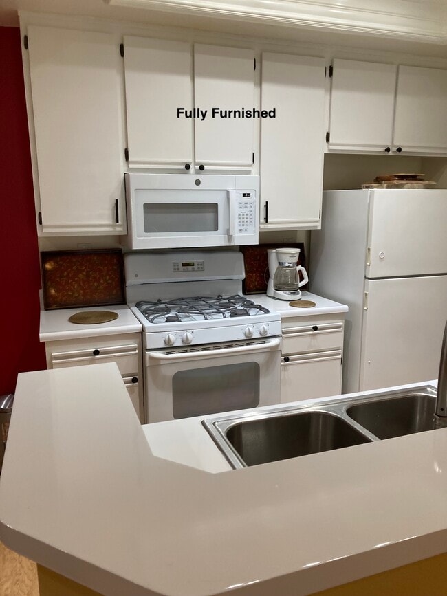 Bright white kitchen with new dishwasher and new microwave - 25252 Via Lido Unit Laguna Niguel Furnished