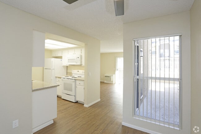 View of kitchen from Living Room - Benchmark Apartments