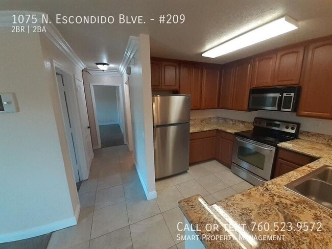 Building Photo - 1075 N Escondido Blvd Unit #209