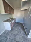 Space for small table for two and small stove/fridge. - 2561 Olive St Unit Upstairs Room