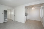 1BR, 1BA - 600SF - Living Room and Dining Room - Palm Court Apartments