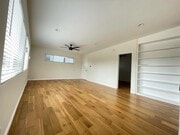 bookcase in living room - 7855 W Manchester Ave Unit 3