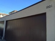 Garage with an access door to the backyard - 1001 S Tamarack Dr Unit 2