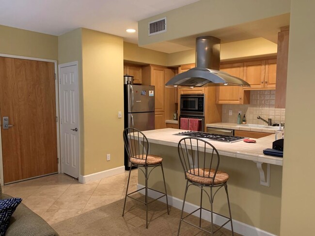 Kitchen with stainless steel appliances - 937 12th St Unit 208