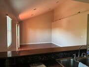 Living/Dining room with balcony - 4210 Thorn St Condo Unit #4