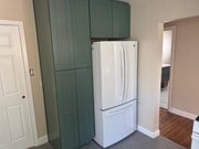 new white glossy French door fridge and gold door handles to be installed. - 10821 Otsego St House