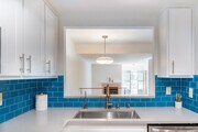Open flow from kitchen to dining room to living room - 6638 Clybourn Ave Condo Unit 41