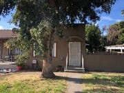 Fenced Front Yard with Mature Trees - 9343 Lomita Dr Townhome
