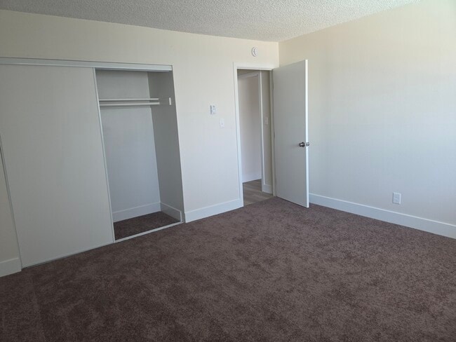 large bedroom with large closet - 5530 Ackerfield Ave Unit 5530 Ackerfield