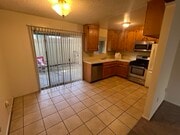 well quipped kitchen with view of patio - 3262 Montrose Ave Unit A