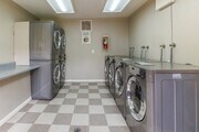 Laundry Room - GRANDE Apartments